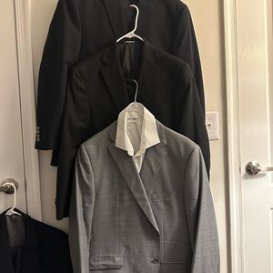 Three suits that are barely used, and tailor fitted to fit a 5 foot eight man